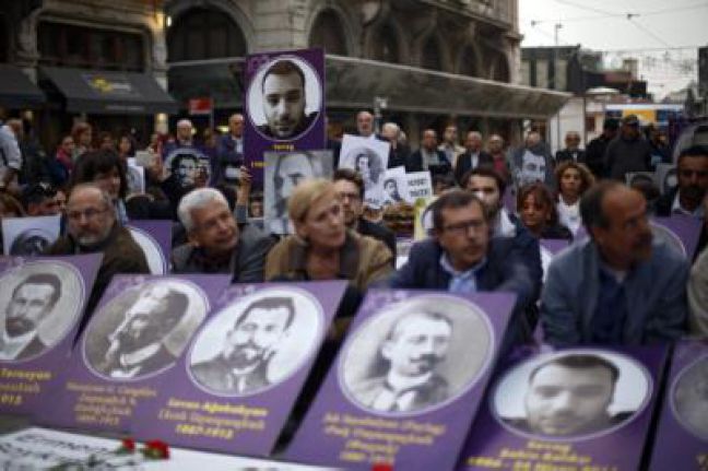 People holding the pictures of killed Armenian people during a protest at the tunnel square to mark the 101st anniversary of the mass killing of Armenians in the Ottoman Empire in 1915, in Istanbul, Turkey, 24 April 2016. The total death toll is estimated to between 800,000 and 1.5 millions. EPA/CEM TURKEL