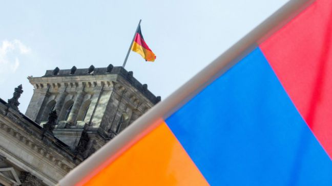 An Armenian flag in front of the Reichstag building in Berlin, Germany, 02 June 2016. The German Bundestag adopted a resolution to name the 1915/16 massacre of the Armeinians by the Ottoman Empire as genocide. Turkey, the legal successor of the Ottoman Empire, had cautioned against the acceptance of the resolution. EPA, ALEXANDER HEINL
